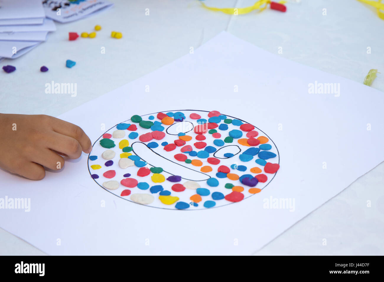 Kids playing with play doh Stock Photo - Alamy