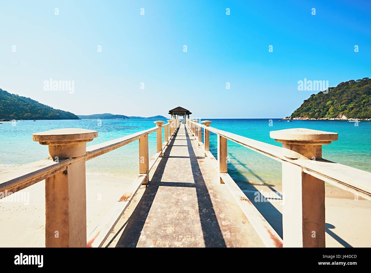 Travel and vacations concept - exotic paradise. Long jetty at Perhentian Islands in Malaysia. Stock Photo