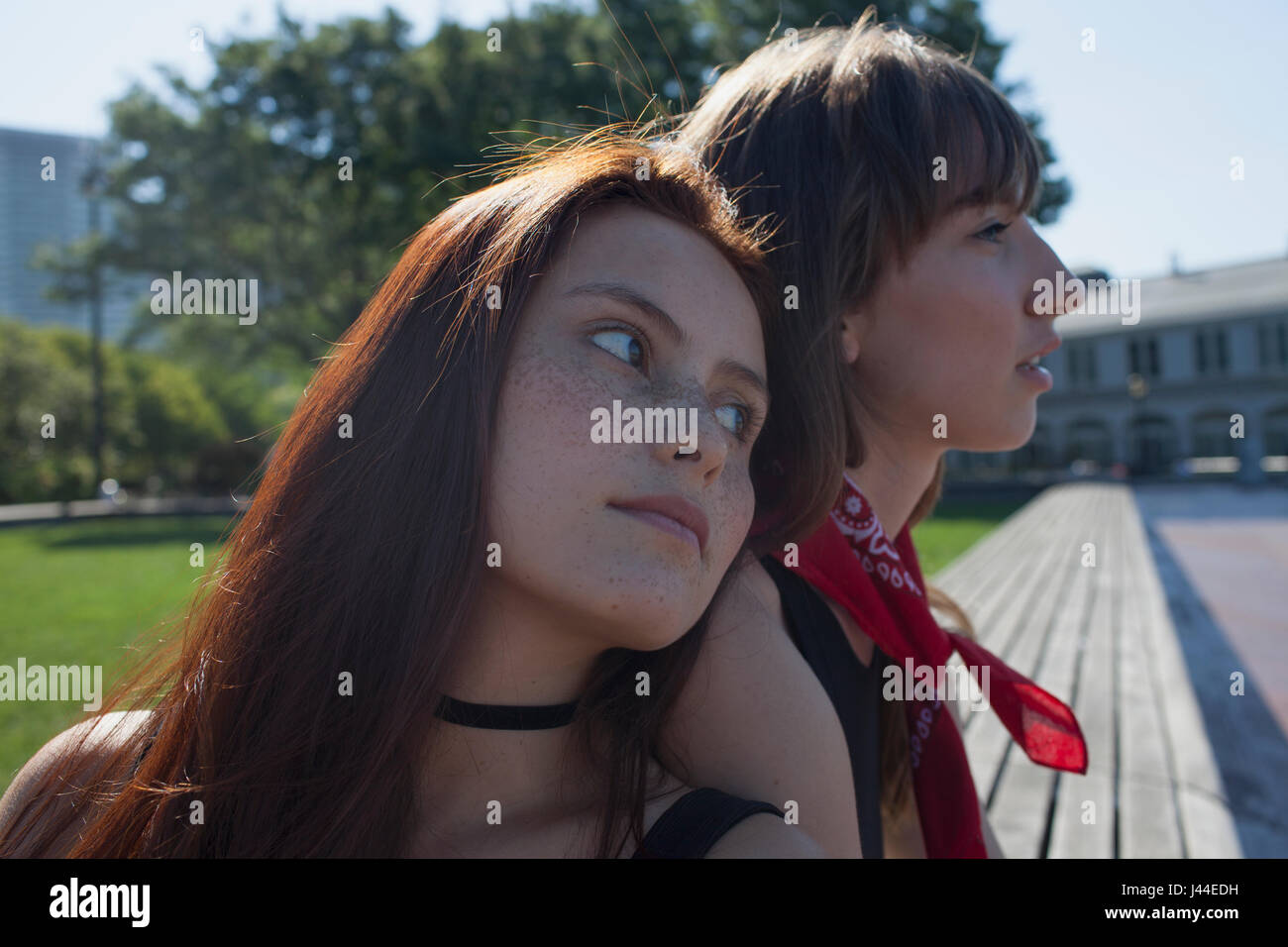 Two young women at a park Stock Photo - Alamy