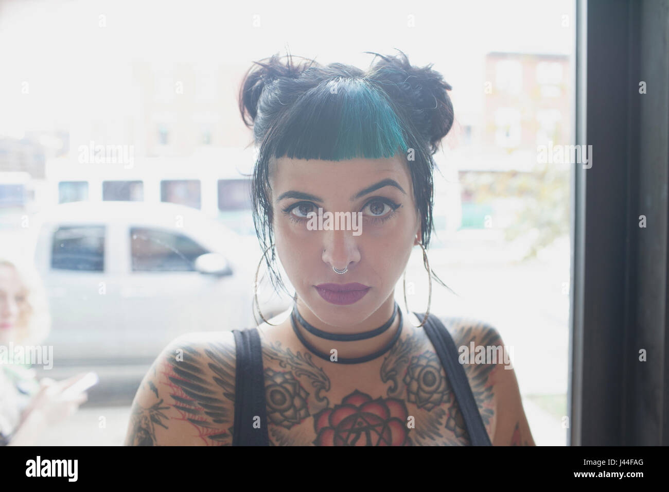 A young woman with black and blue hair. Stock Photo