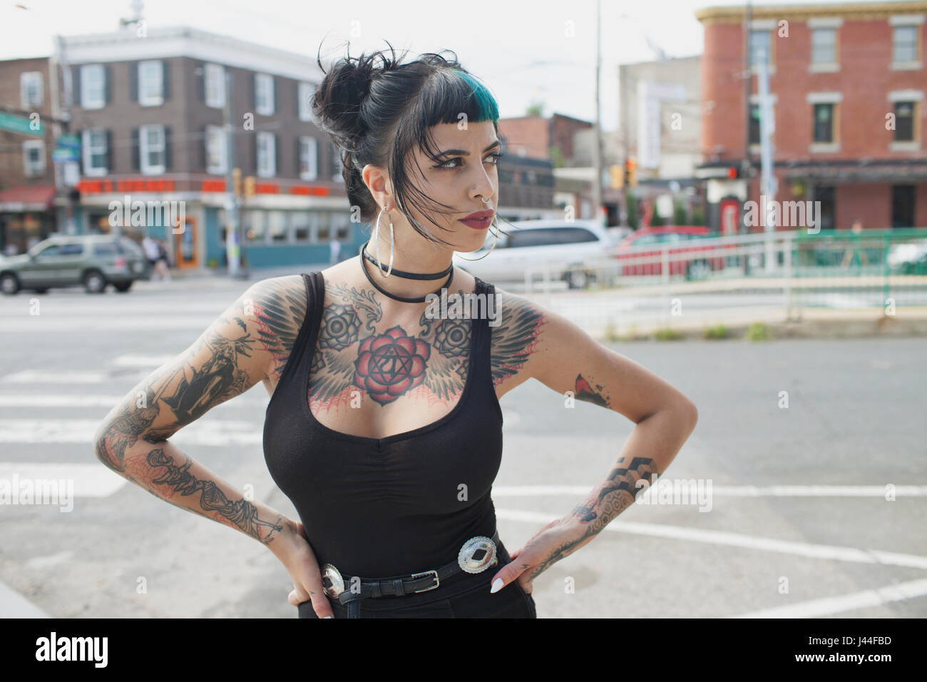 A portrait of a young woman with black and blue hair. Stock Photo
