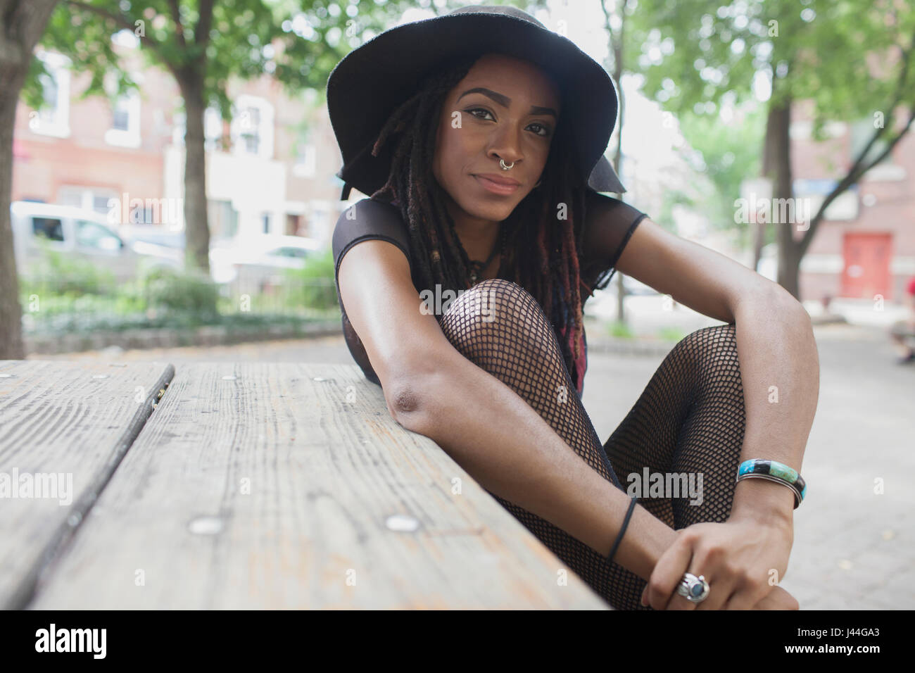 A young woman wearing a black hat Stock Photo - Alamy