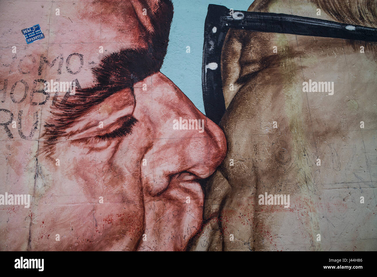 'The Kiss' depicting Soviet leader Leonid Brezhnev and East German President Erich Honecker in a fraternal embrace painted on the Berlin Wall. Stock Photo