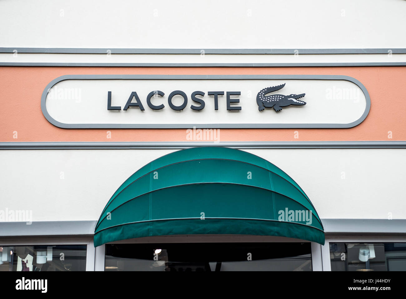 Roermond, Netherlands 07.05.2017 - Logo of Lacoste Store in the Mc Arthur  Glen Designer Outlet shopping area Stock Photo - Alamy
