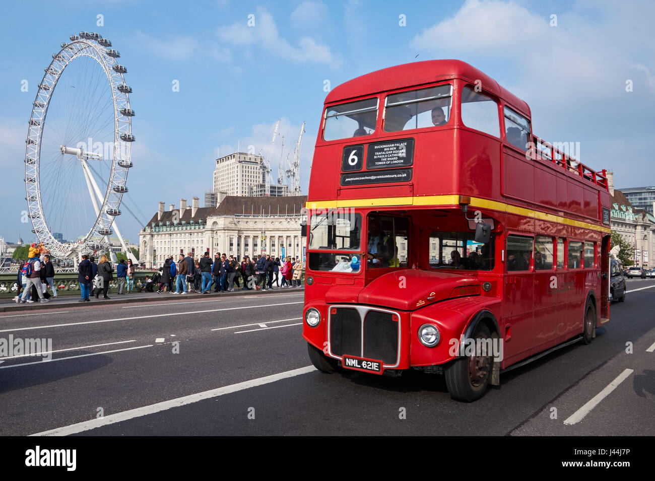 The old Routemaster bus on Westminster Bridge with London Eye in the background, London England United Kingdom UK Stock Photo