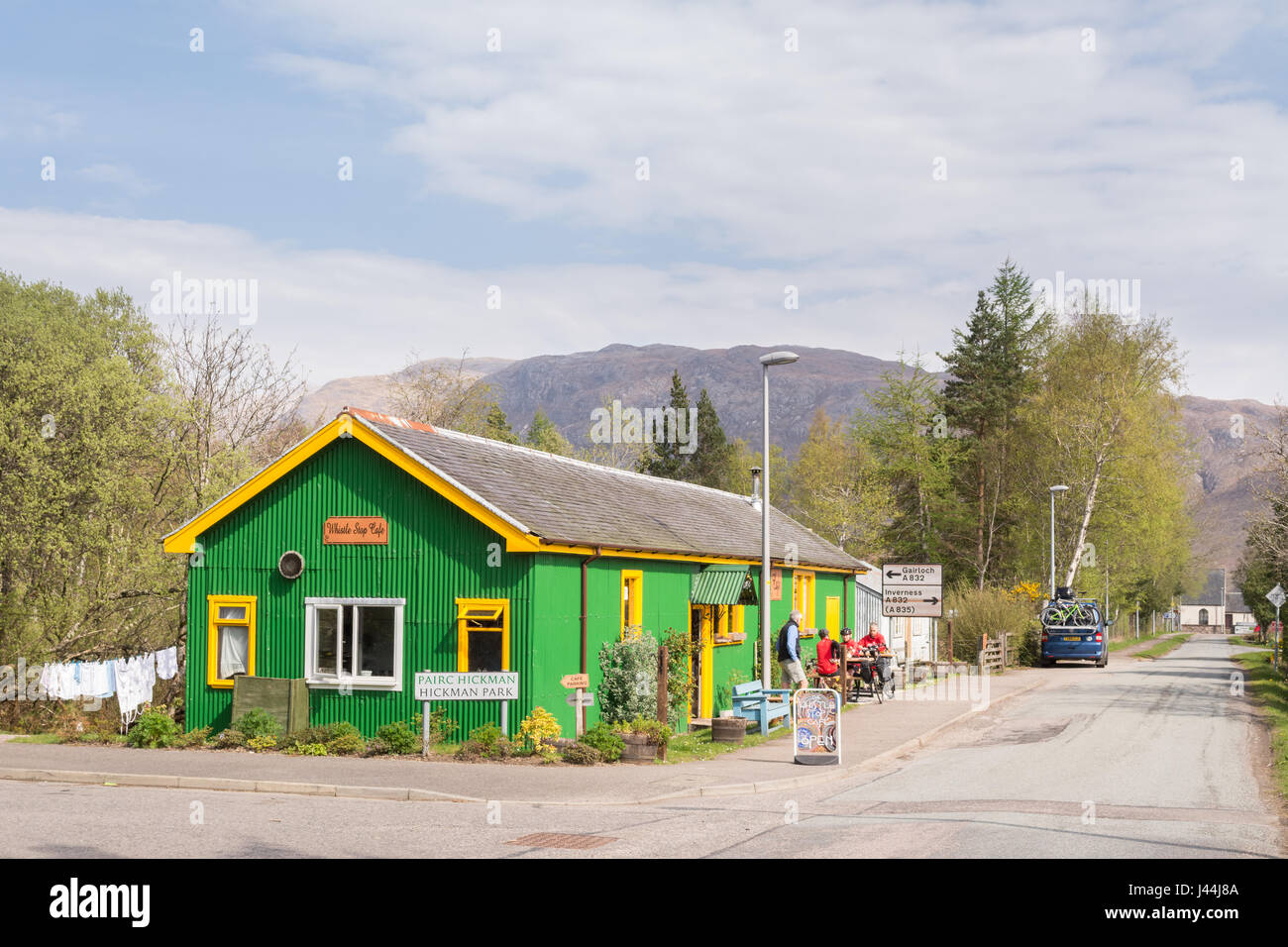 North Coast 500 Cyclists taking a break outside the Whistle Stop Cafe