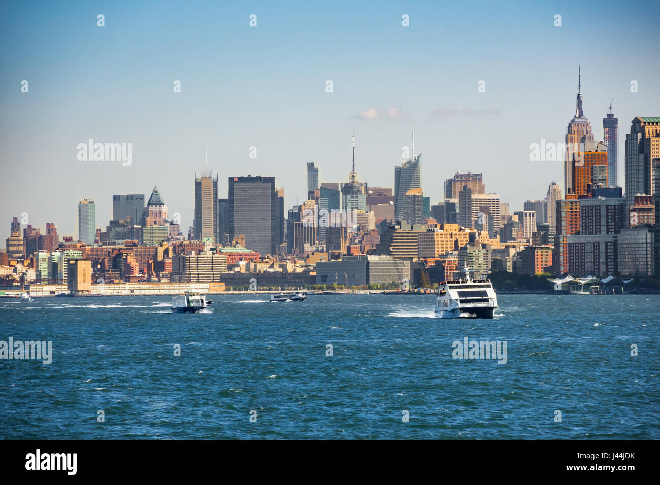 Boats on Hudson River in front of New York Skyline Stock Photo