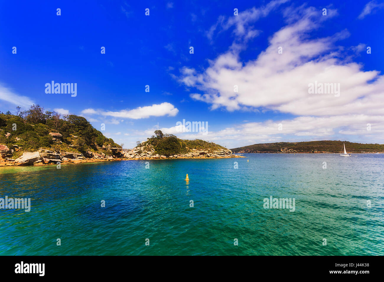 Tropical climate and sunny summer weather at inner bay of Sydney harbour around historic heritage Quarantine station. Stock Photo