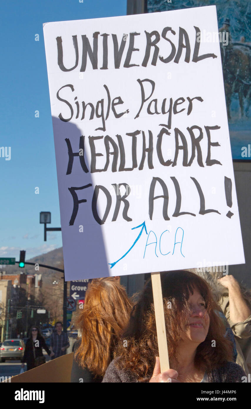 Asheville, North Carolina, USA - February 25, 2017: Woman holds a sign saying 'Universal Single Payer Healthcare For ALL' at an Obamacare Stock Photo