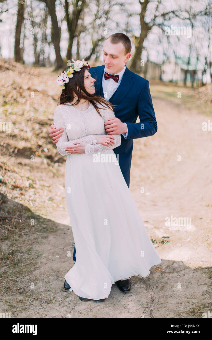 Wedding Portrait Of Happy Stylish Newlywed Bride And Groom Posing