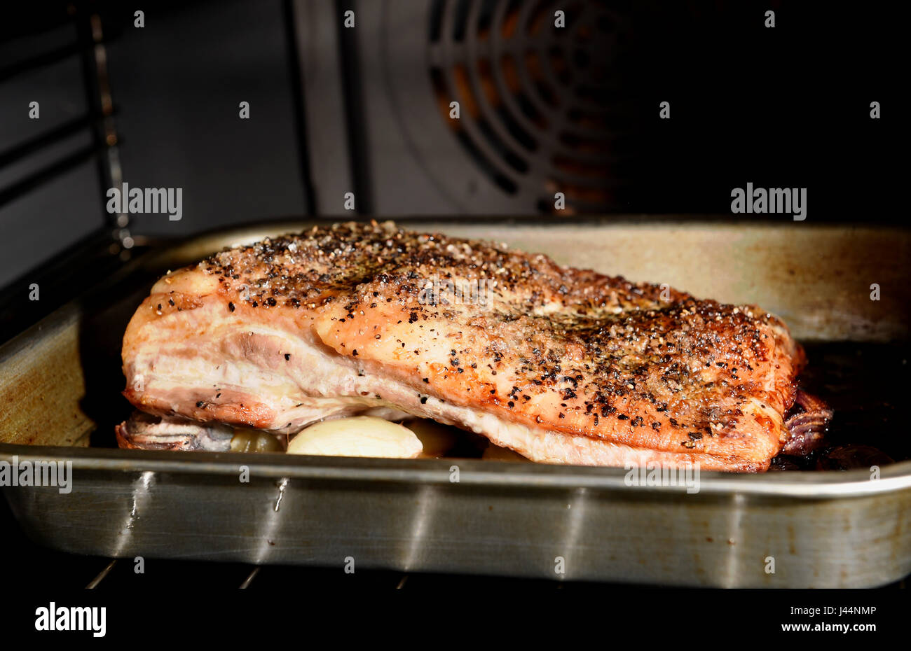 Belly Pork joint with crackling cooking in a fan oven Photograph taken