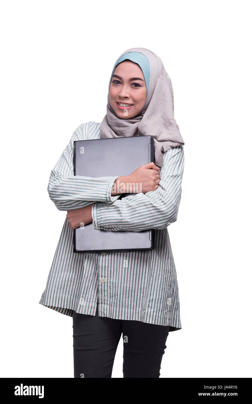 Smiling asian muslim woman with laptop isolated over white background ...