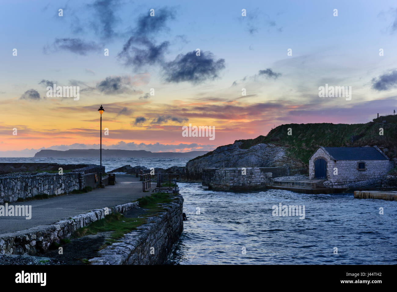 Ballintoy Harbour on the Causeway Coast of North Antrim between Bushmills and Ballycastle in Northern Ireland. Seen here at dawn. Stock Photo