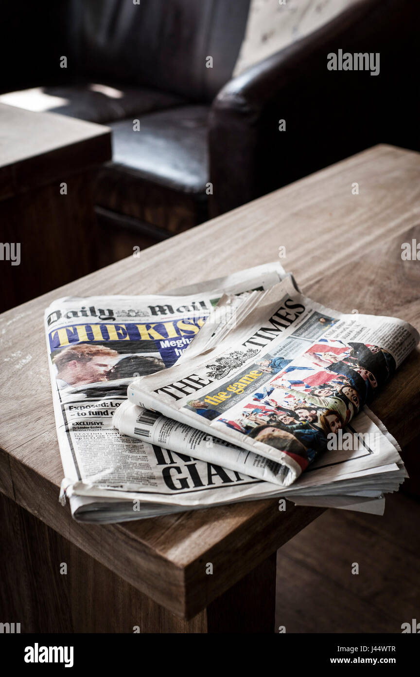 Newspapers on a table The Times newspaper Daily Mail newspaper Used Read Table Print Periodicals Editions Stock Photo