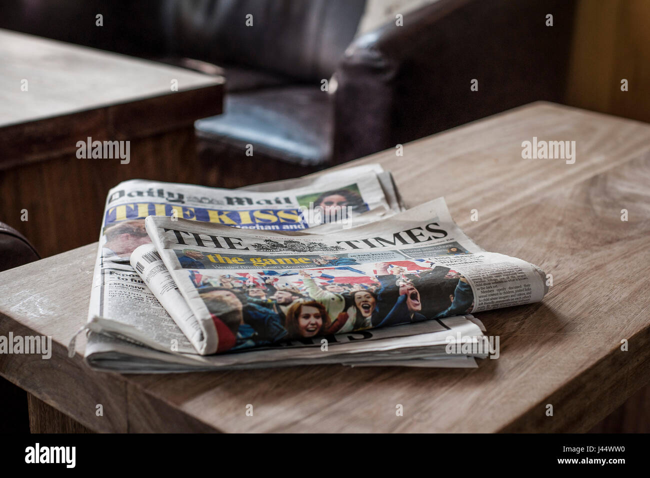 Newspapers on a table The Times newspaper Daily Mail newspaper Used Read Table Print Periodicals Editions Stock Photo