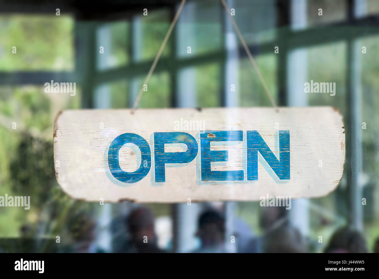 An Open sign in the window of a cafe Information Graphic Word Stock Photo