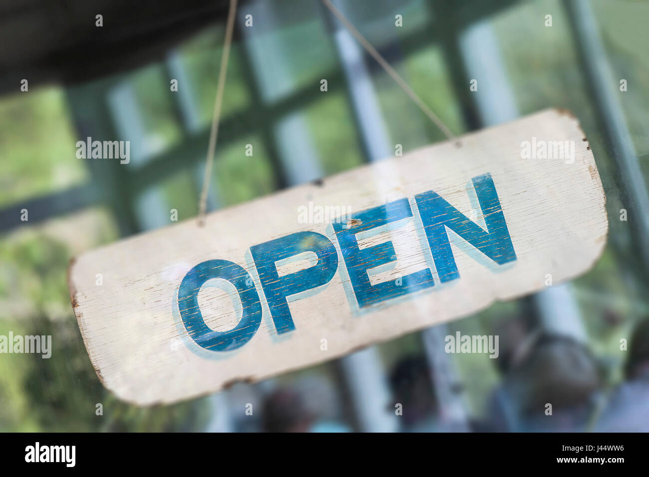 An Open sign in the window of a cafe Information Graphic Word Stock Photo