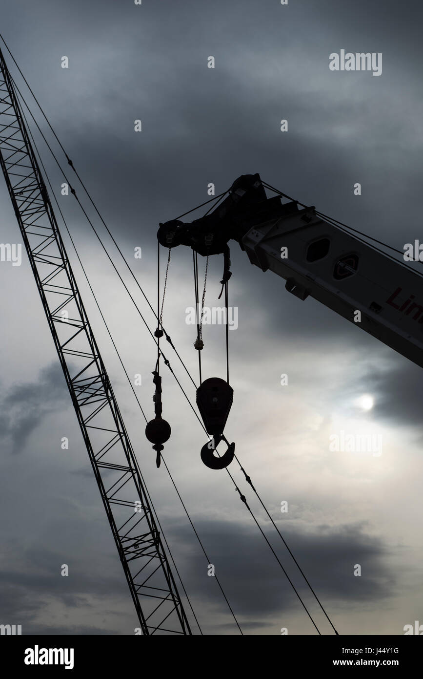 Two cranes against a dramatic sky. Stock Photo