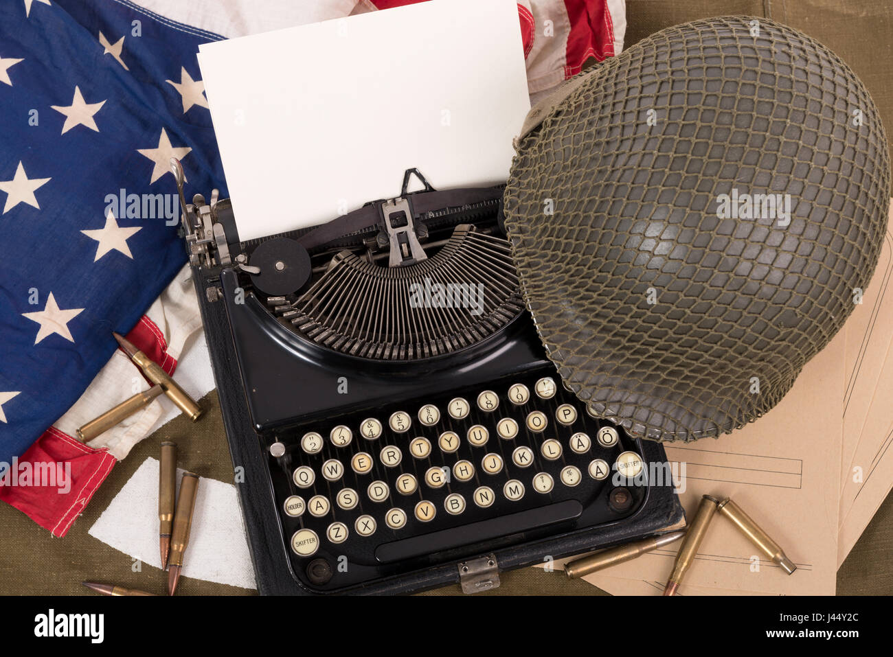 the US military helmet of the Second World War with old typewriter ...