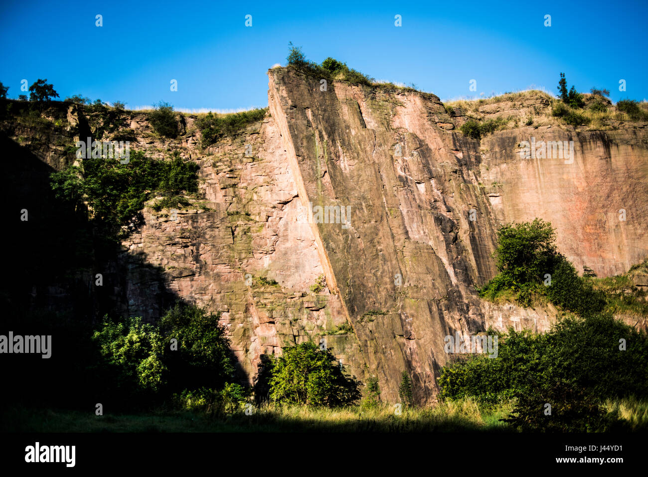 Big climbing wall in Germany, sunny day. Stock Photo