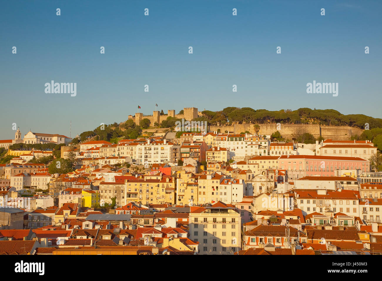 Portugal, Estredmadura, Lisbon, Bairro do Castello, Castelo de Sao Jorge, St Georges castle seen at sunset from Chiado. Stock Photo