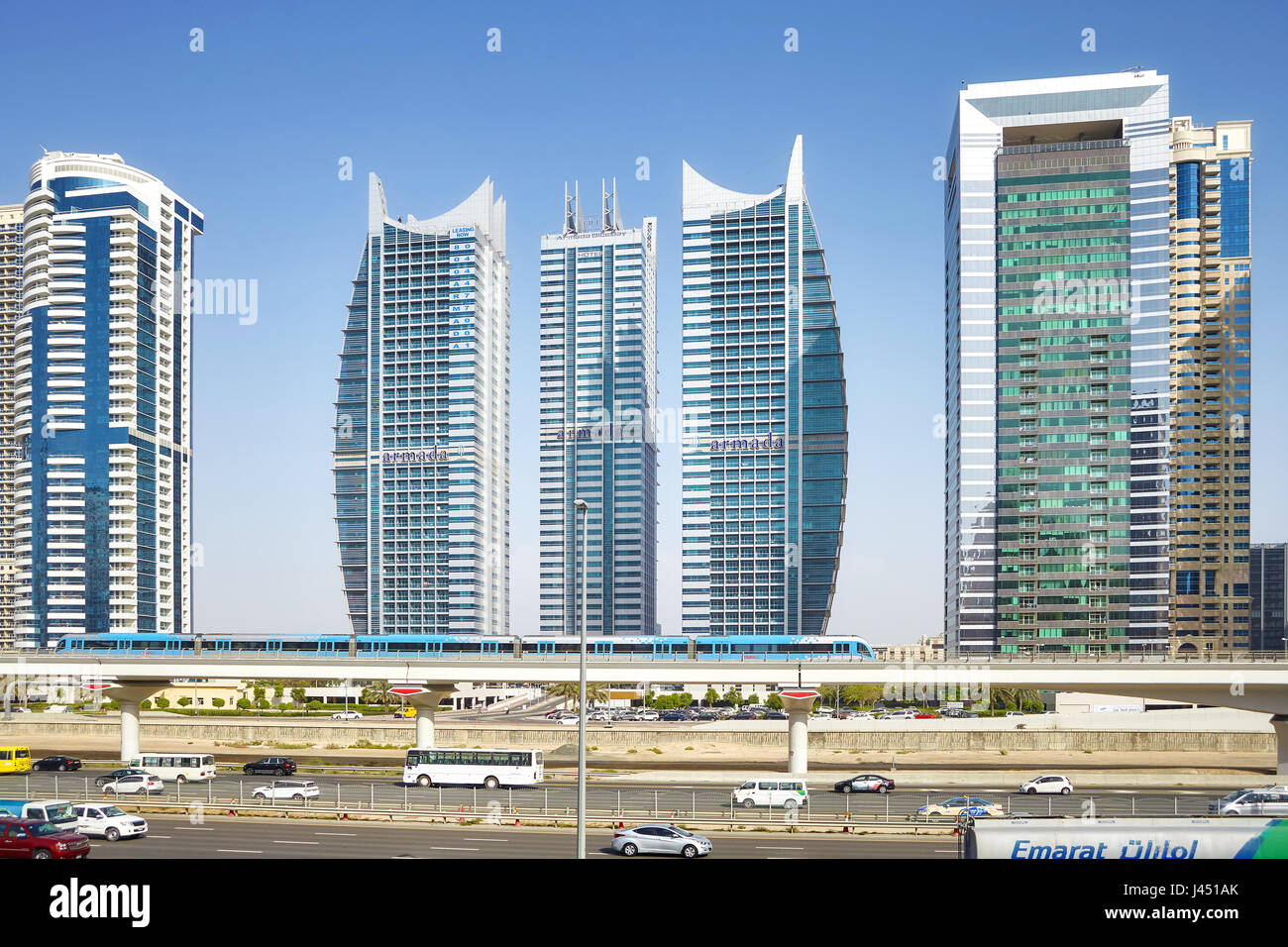 Dubai, United Arab Emirates - May 04, 2017: City downtown with skyscrapers and transport infrastructure. Dubai Metro is one of the worlds longest driv Stock Photo