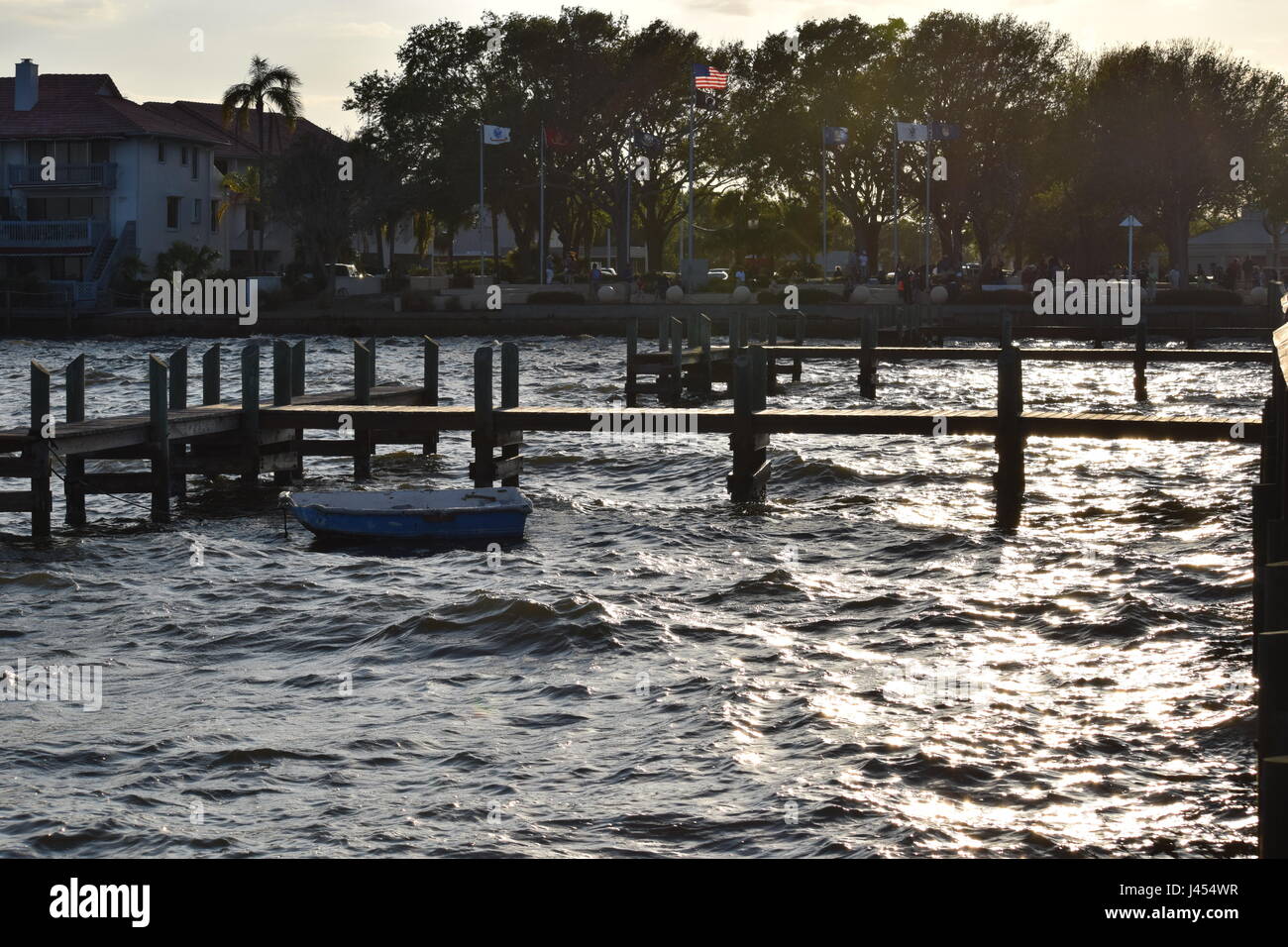 Dinghy at the docks in rough water Stock Photo - Alamy