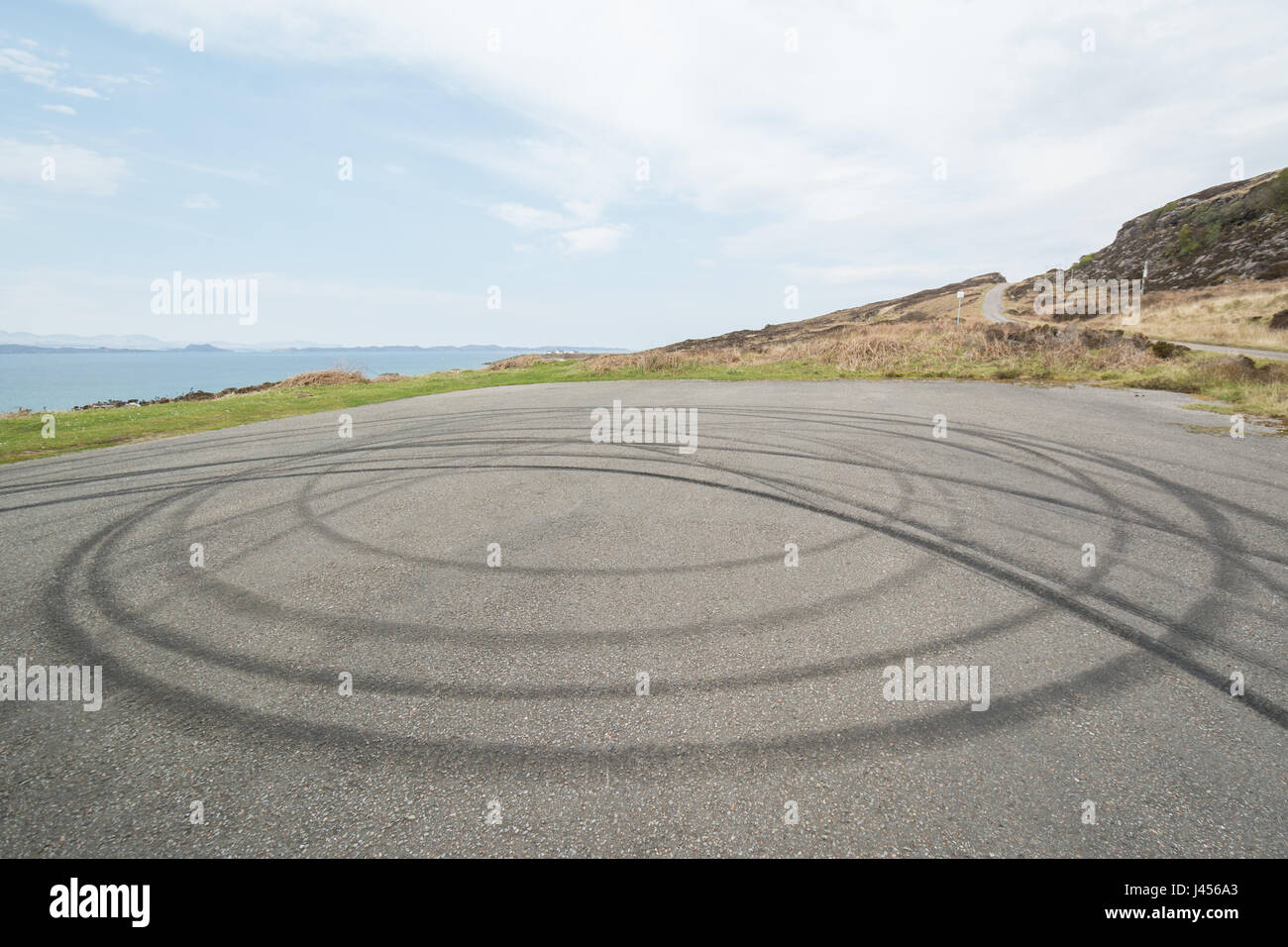 donut car tyre skid marks at viewpoint, Applecross peninsula, Wester Ross, Scottish Highlands, UK Stock Photo