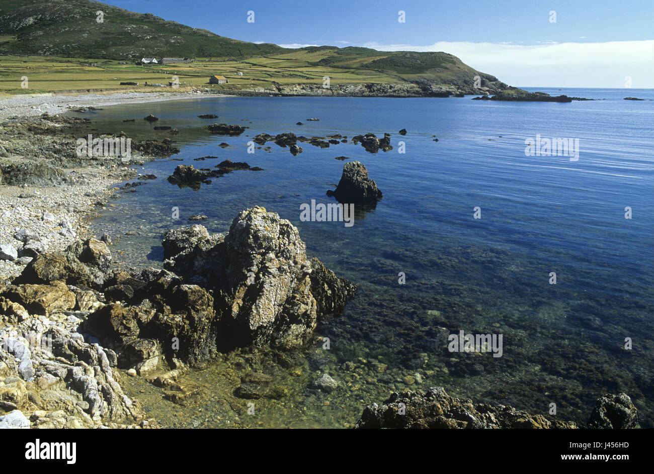 A rocky shore at high tide on Bardsey Island, off the coast of Wales, United Kingdom. Stock Photo