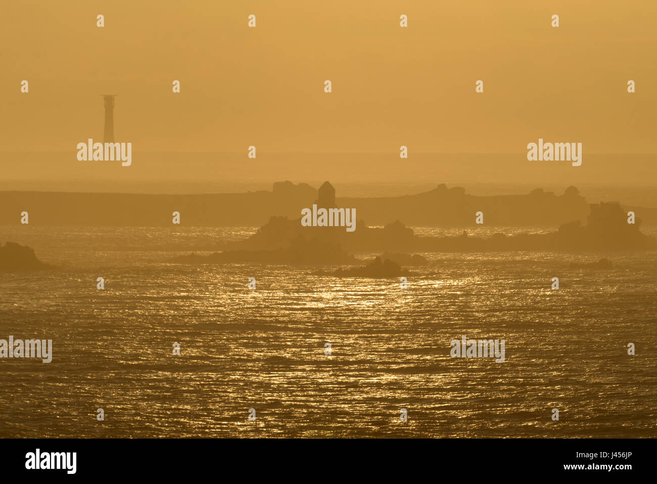 Bishop Rock Lighthouse and the western isles from St Agnes, Isles of Scilly, UK Stock Photo
