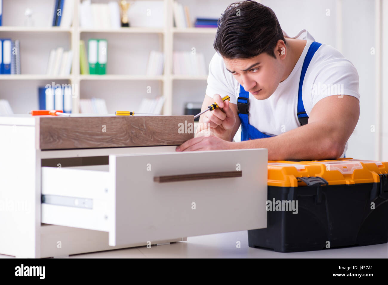 Furniture repair and assembly concept Stock Photo Alamy