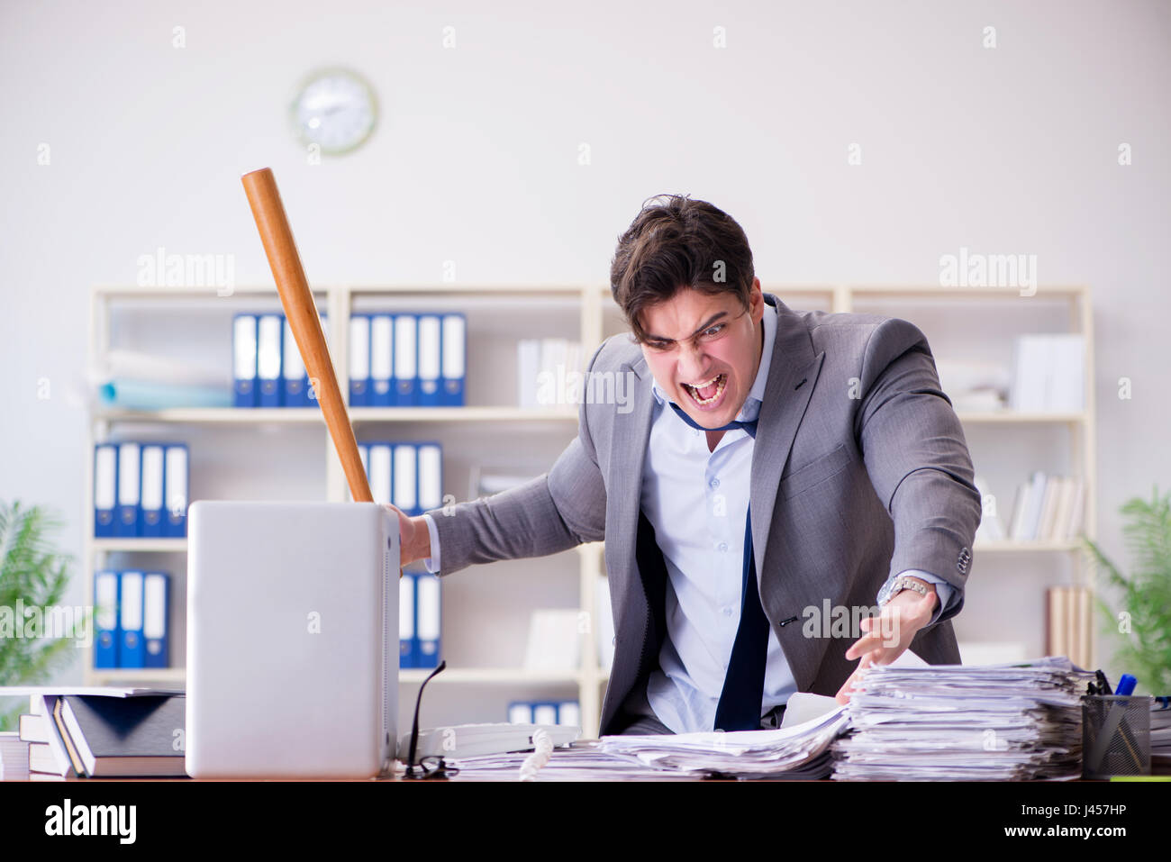 Angry aggressive businessman in the office Stock Photo - Alamy