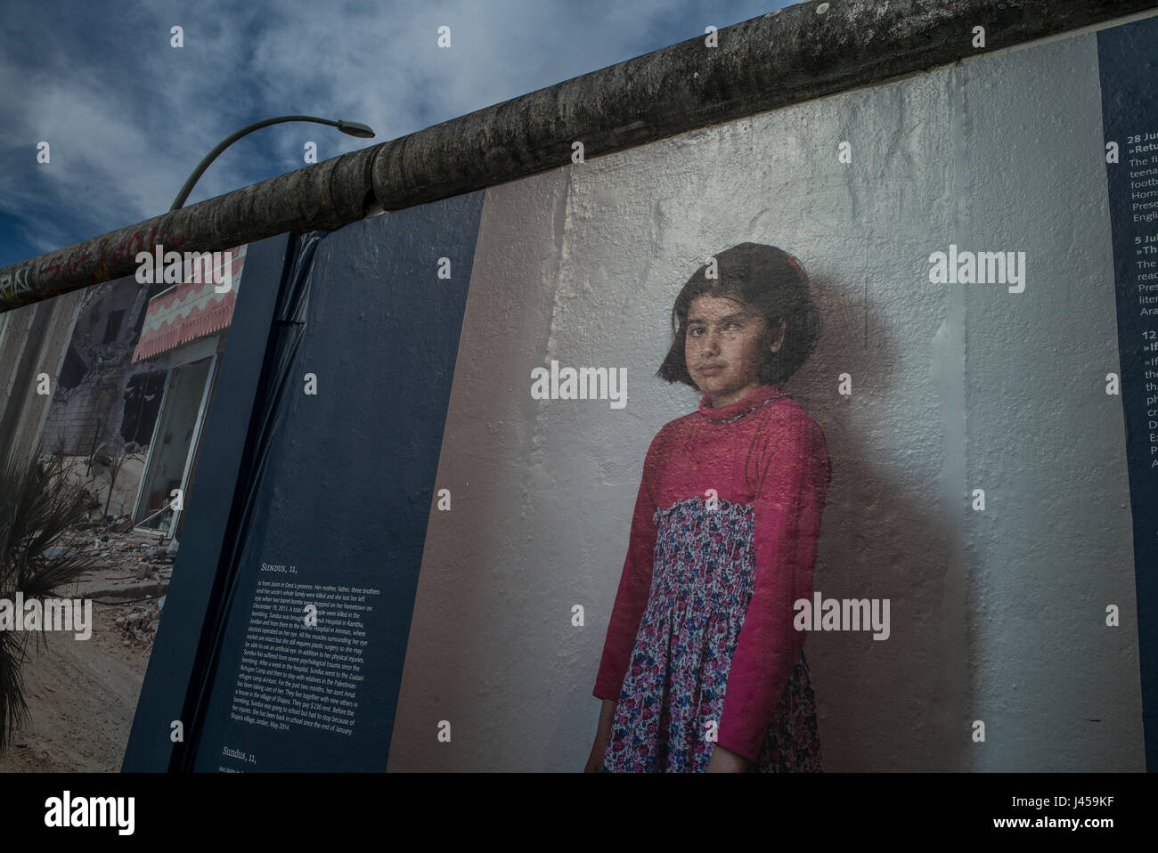 The 'War on Wall' consequences of the war in Syria exhibition by the German photographer Kai Weidenhofer that was displayed on the Berlin Wall. Stock Photo