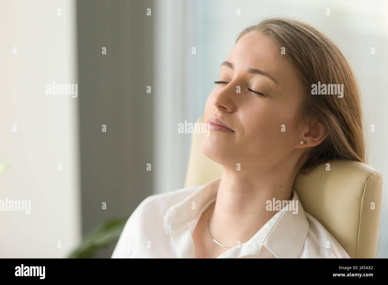 Businesswoman sleeping on chair hires stock photography and images Alamy