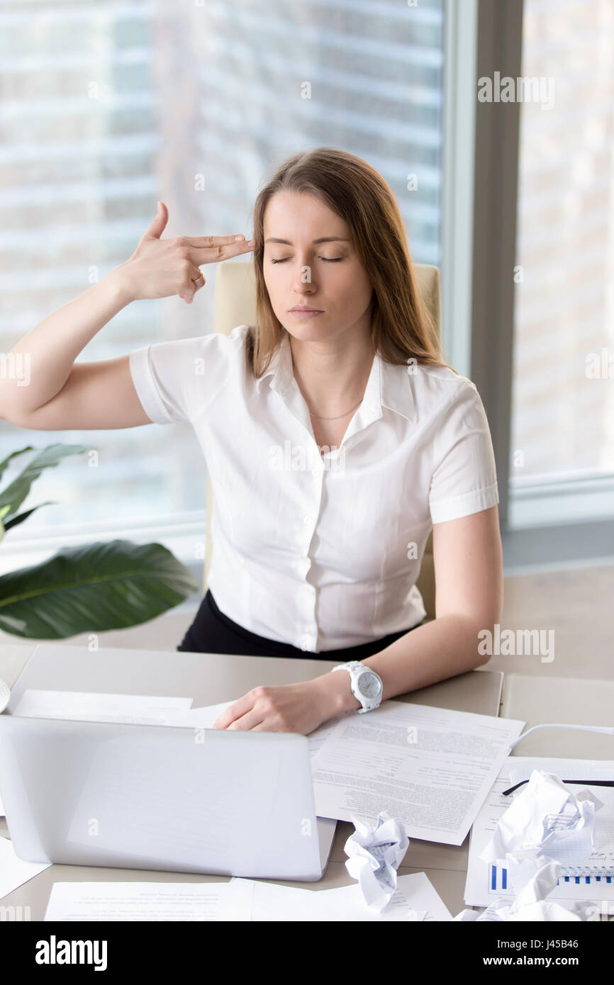 Tired female entrepreneur with suicidal thoughts Stock Photo
