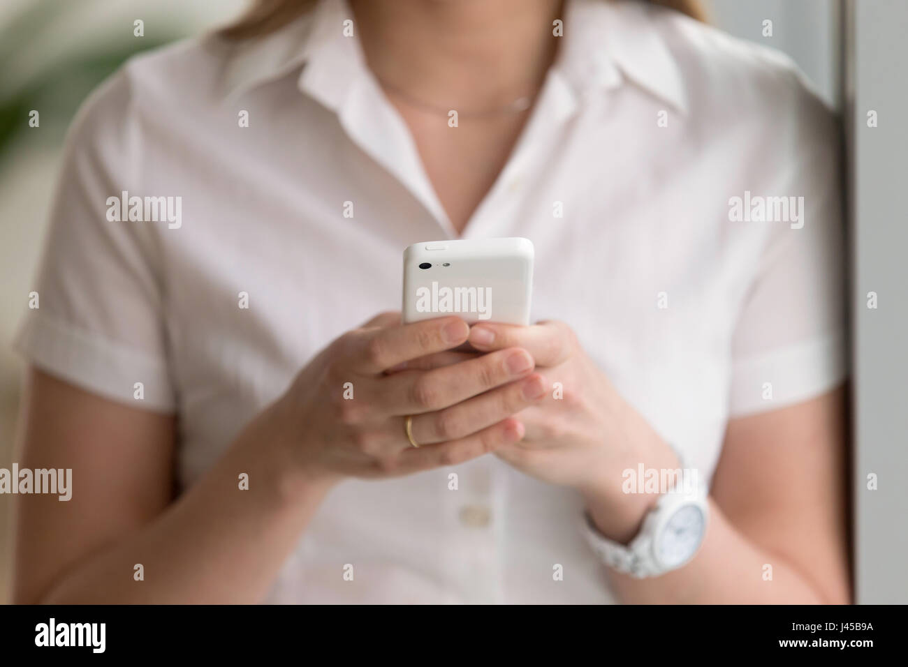 Close up photo of trendy cellphone in womans hands Stock Photo