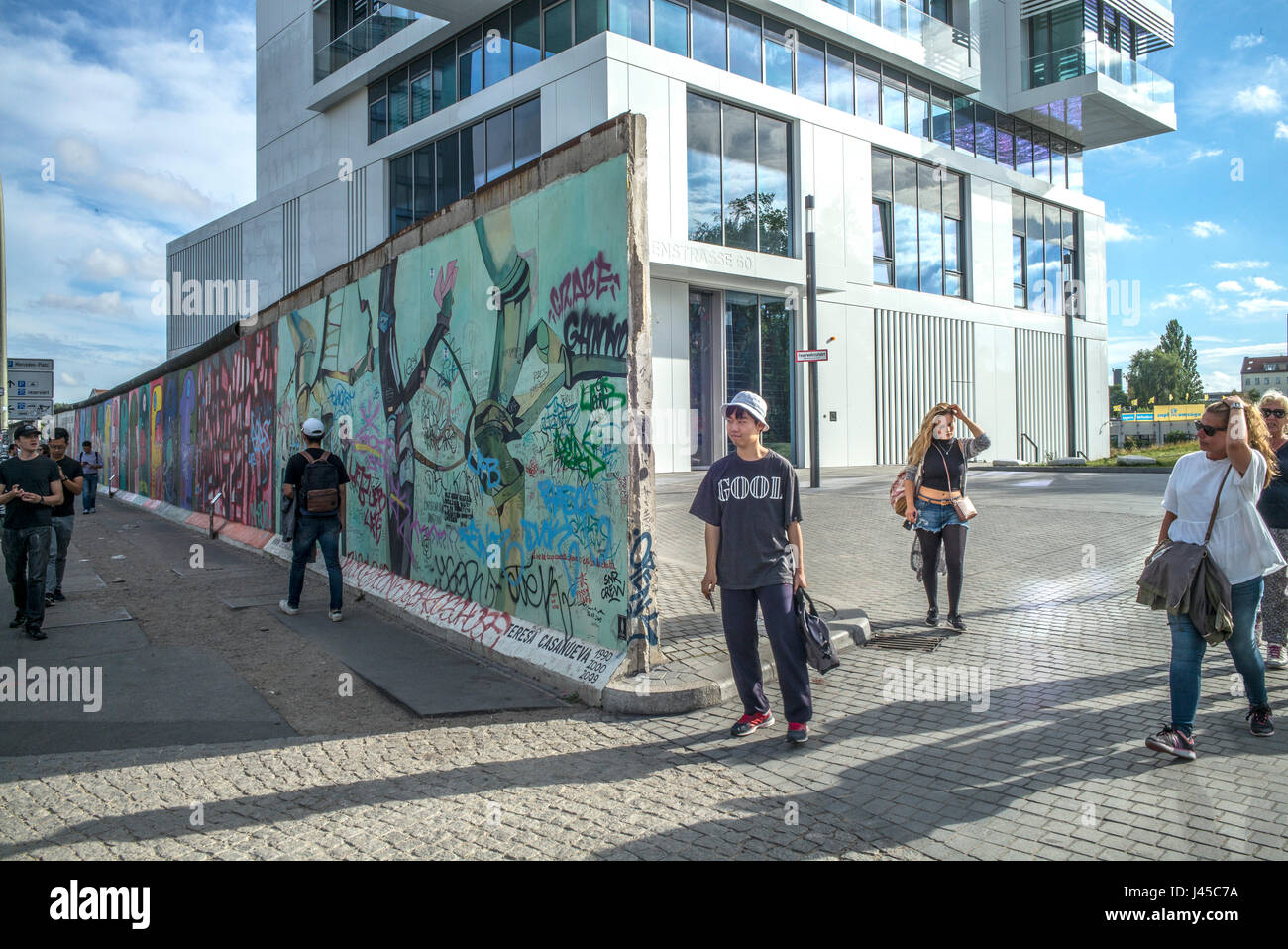 A section of the East Side Gallery on Mühlenstrasse, Berlin, site of the few last remaining parts of the Berlin Wall adorned by various artists and gr Stock Photo