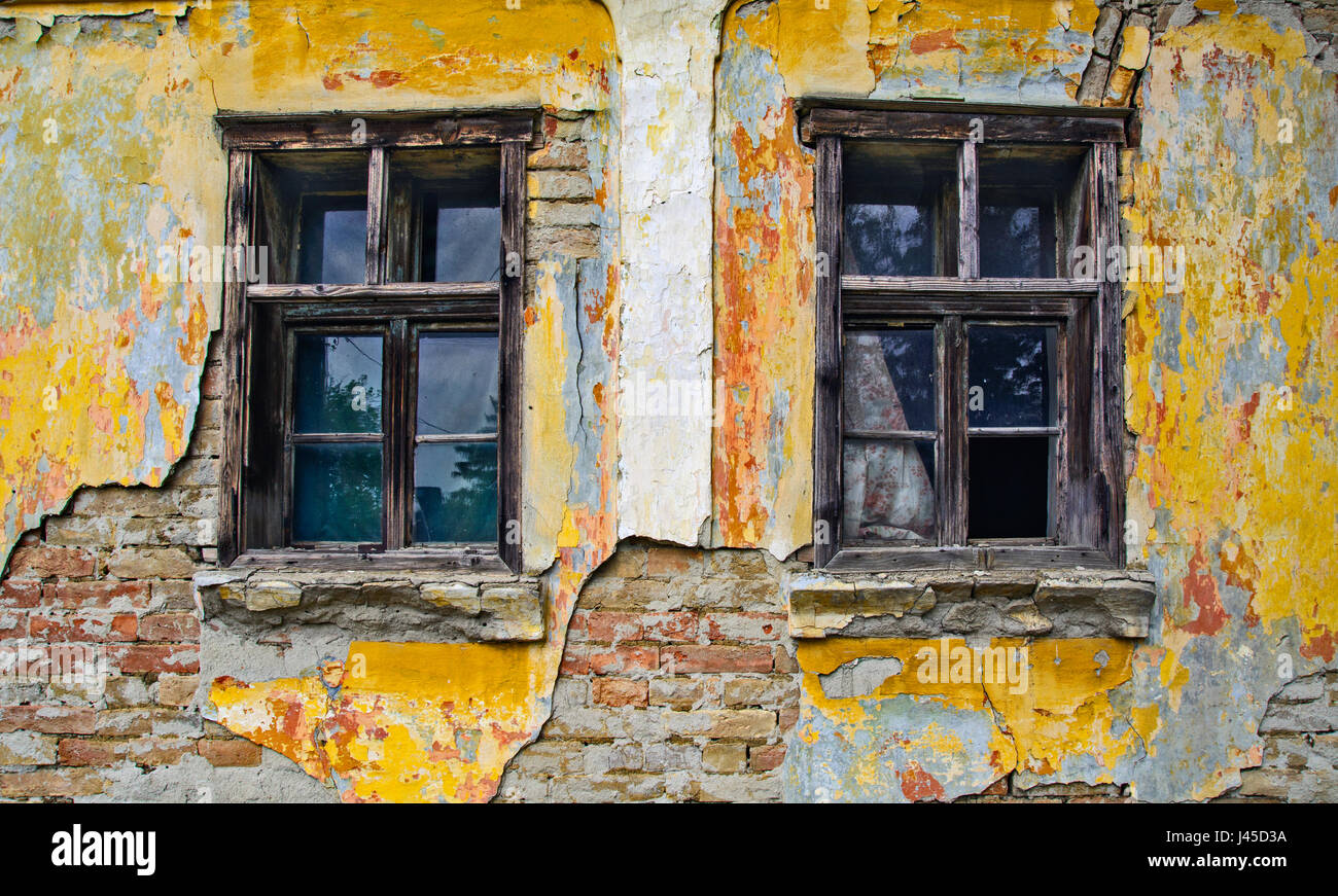 Old window on a farmhouse in Serbia who still resists time. Stock Photo