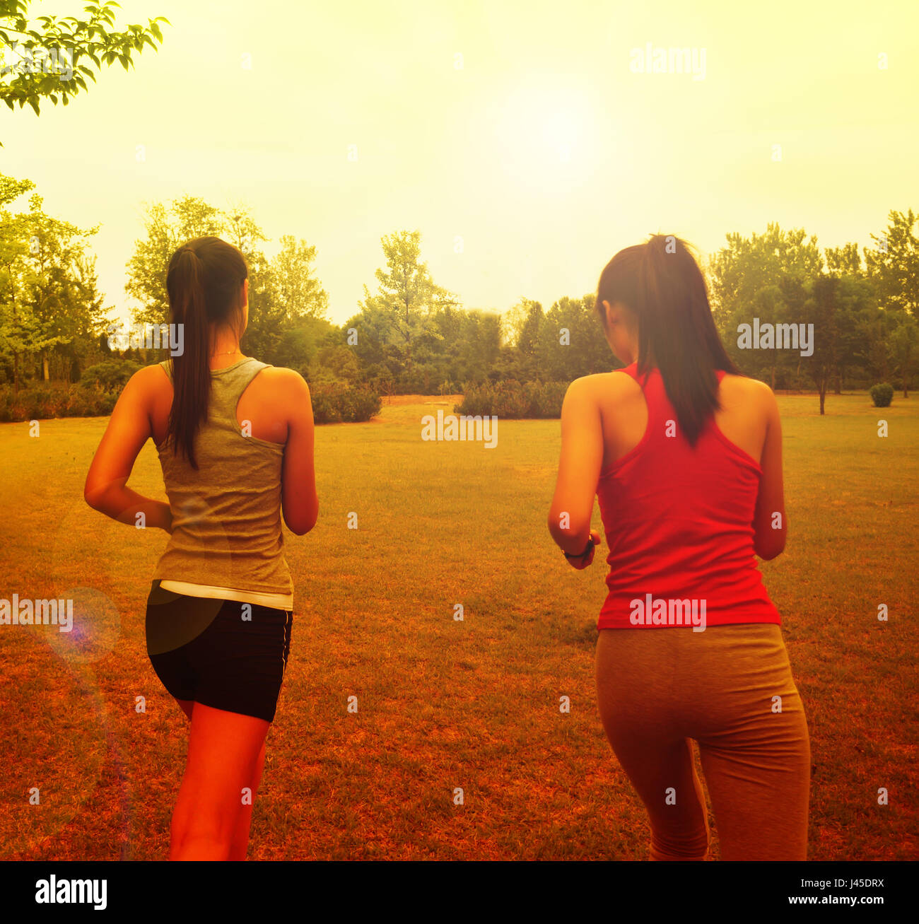 Two girls running hires stock photography and images Alamy
