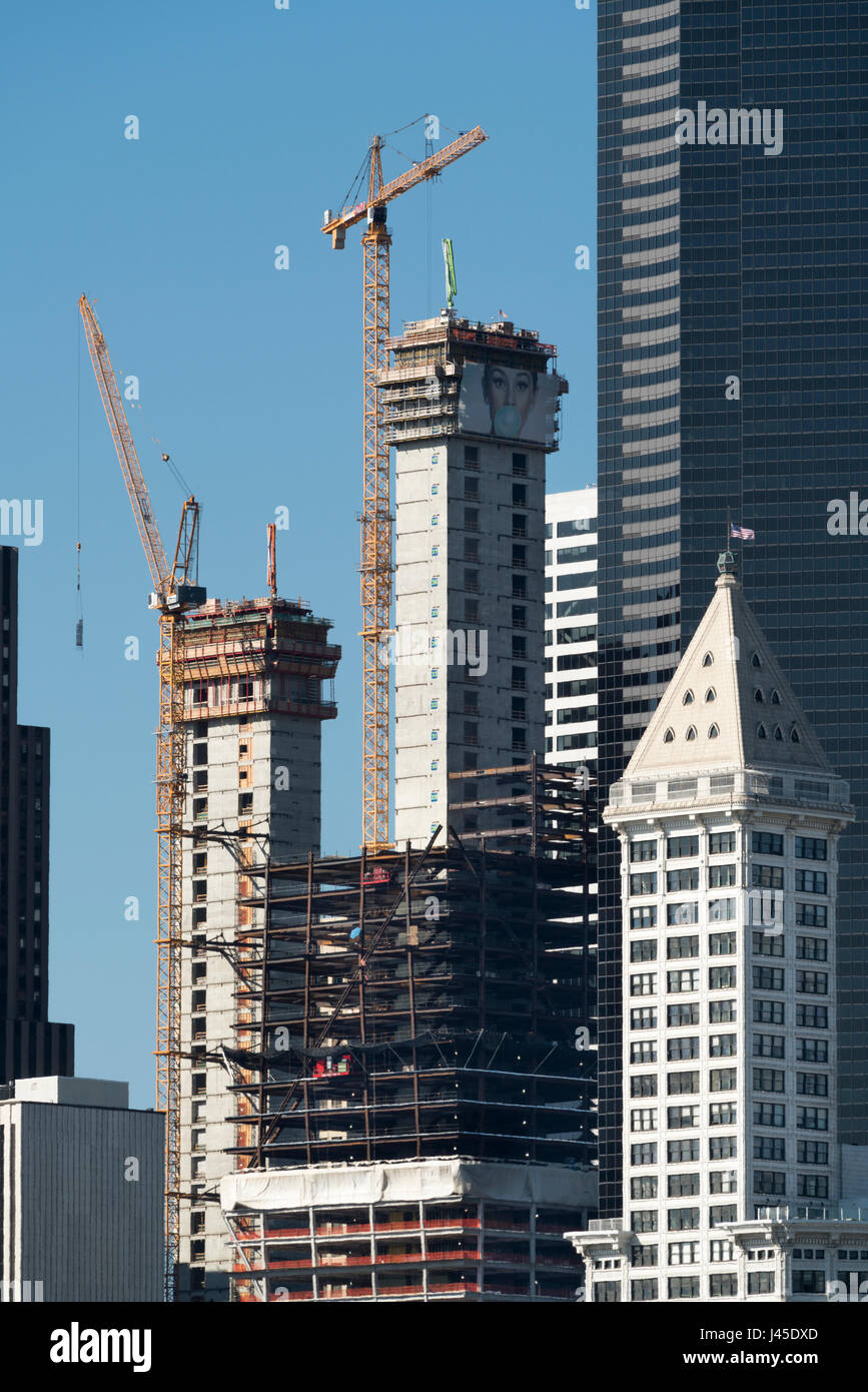 United States, Washington, Seattle, Smith Tower with building construction going on around it. Stock Photo