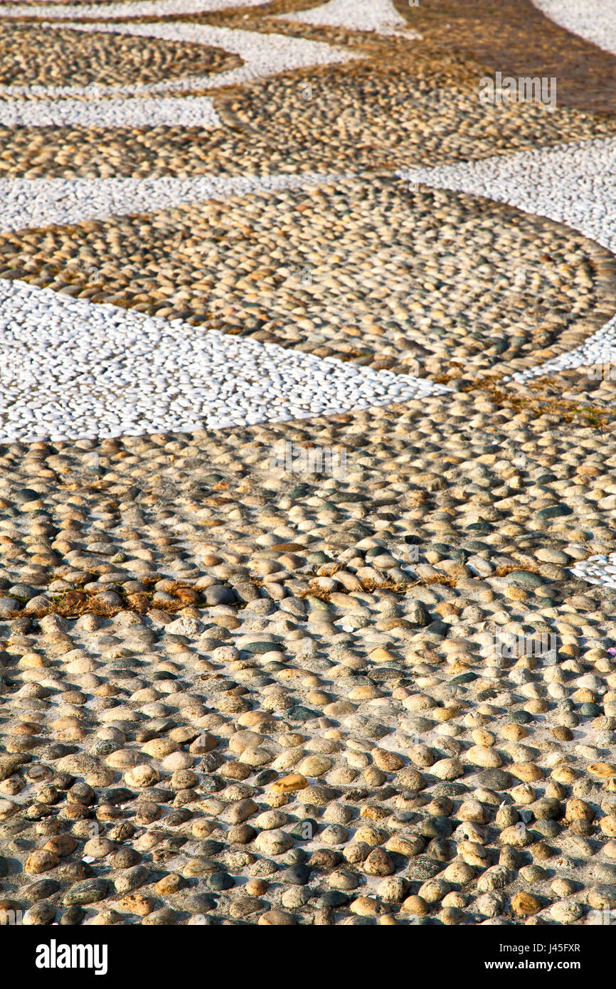in parabiago street lombardy italy varese abstract pavement of a curch ...