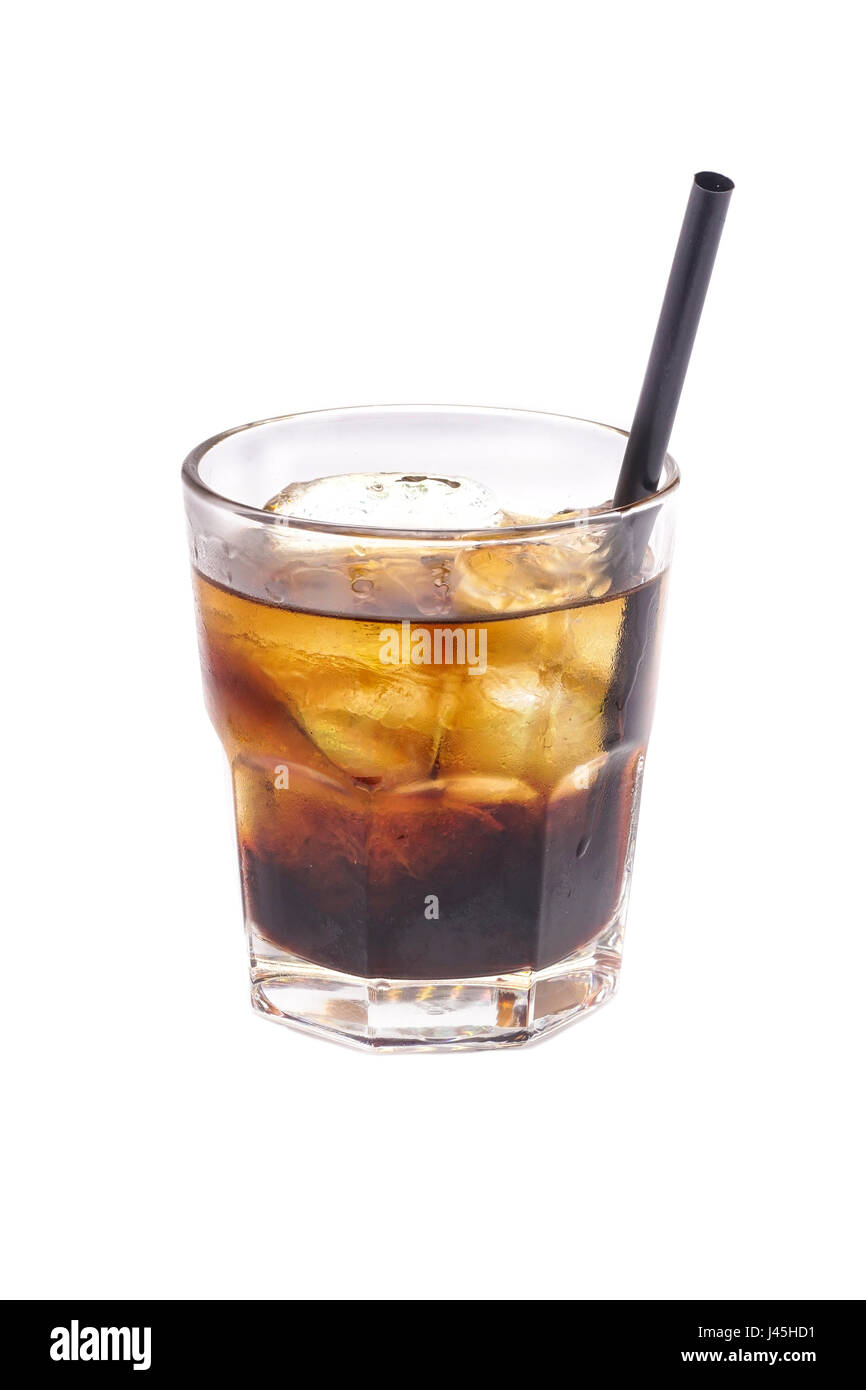 Close up of glass with iced alcohol cocktail with whisky and cola isolated on a white background. Stock Photo