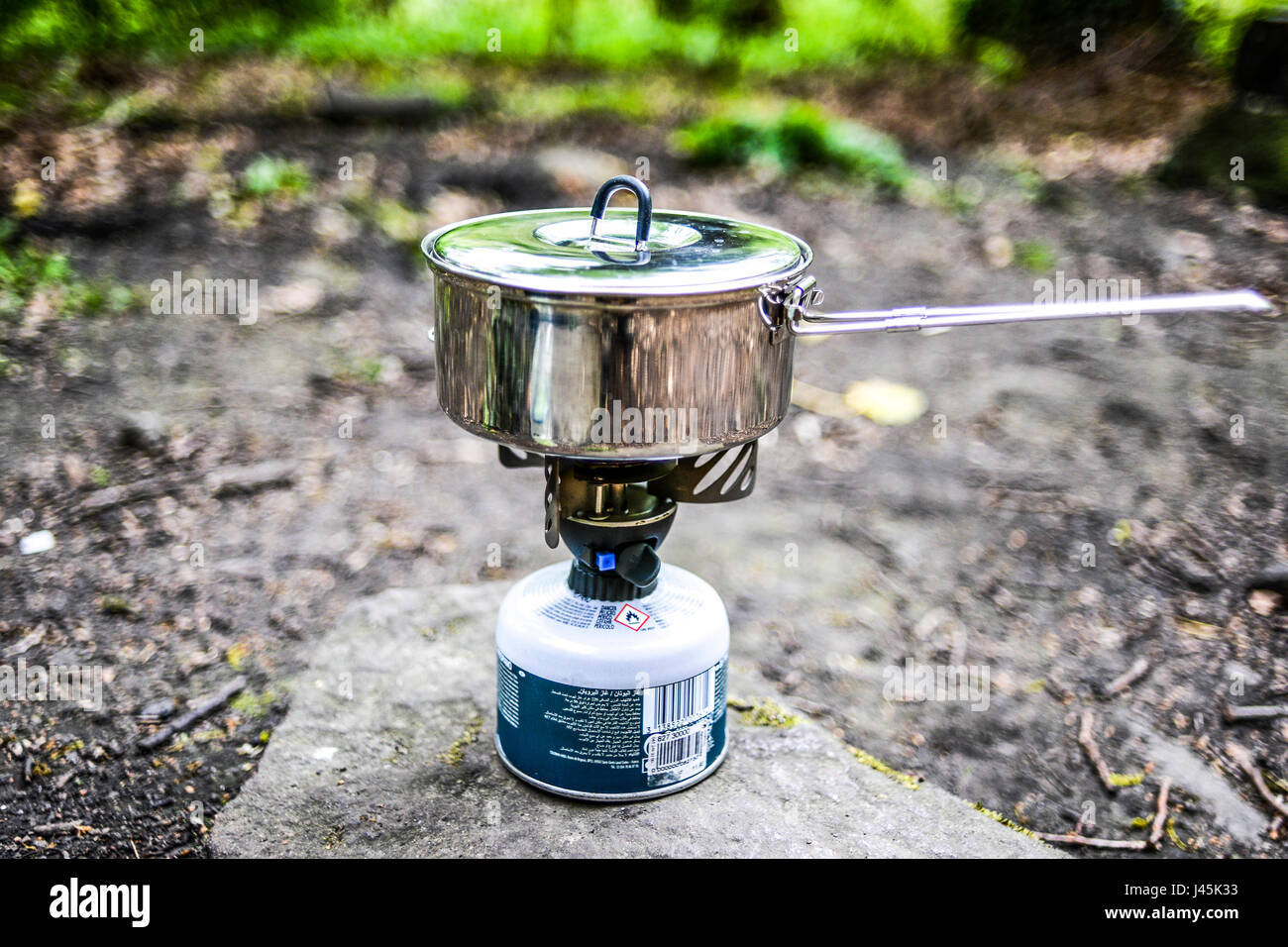 Outdoor cooking on a gas stove, survival. Stock Photo