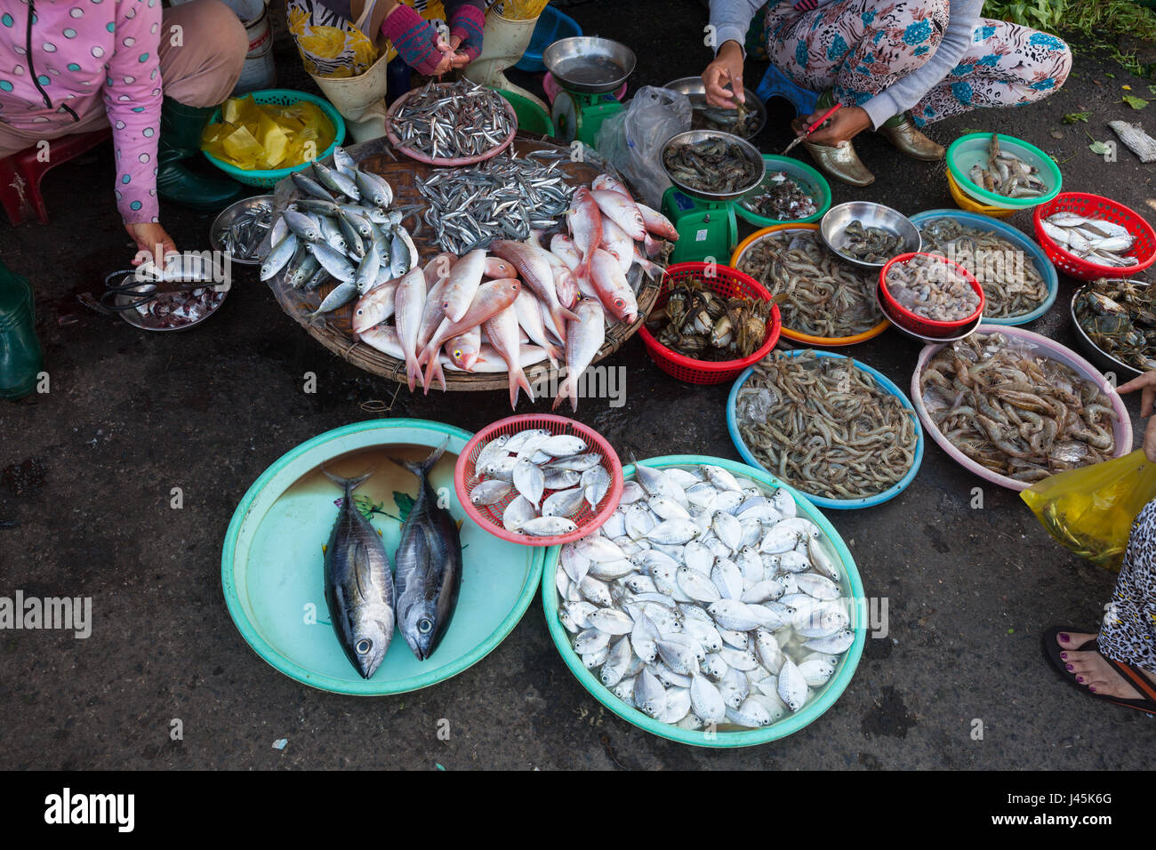 Women are selling seafood at the wet market. Nha Trang, Vietnam. Stock Photo