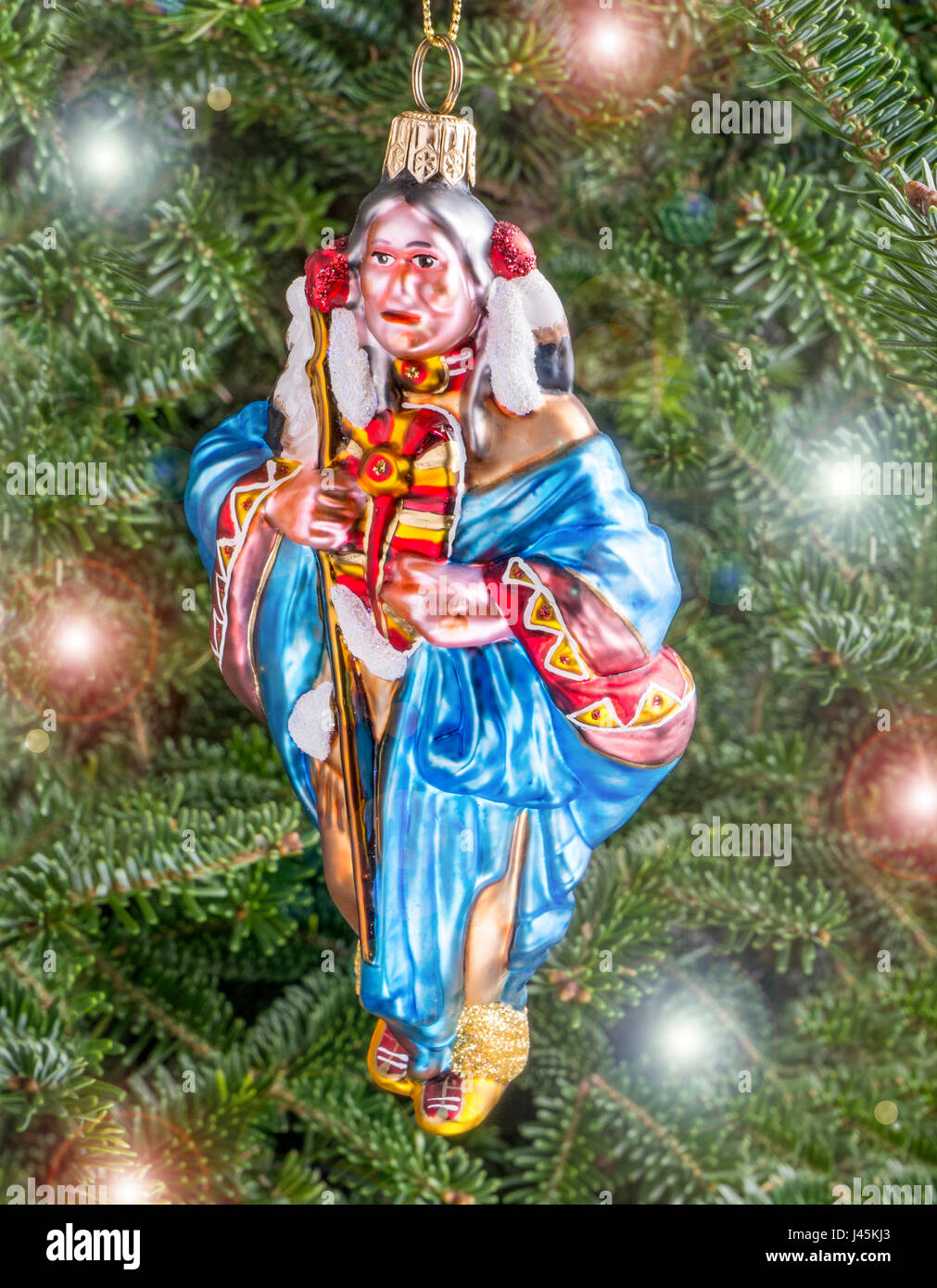 Christmas bauble hanging from a tree in the shape of a Indian Squaw Stock Photo