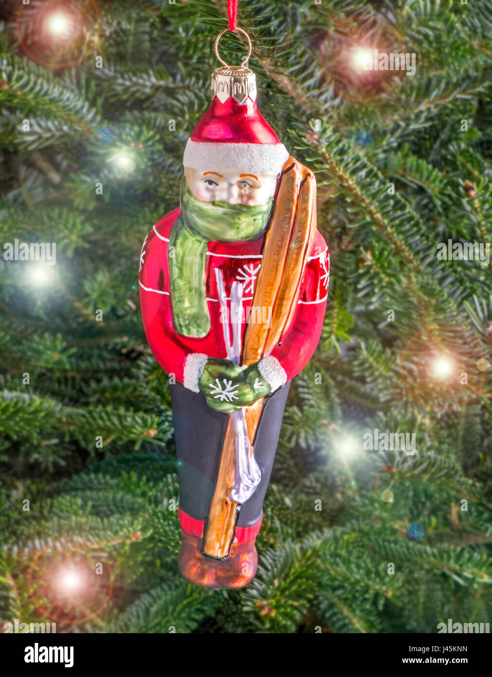 Christmas bauble hanging from a tree in the shape of a Skier Stock Photo