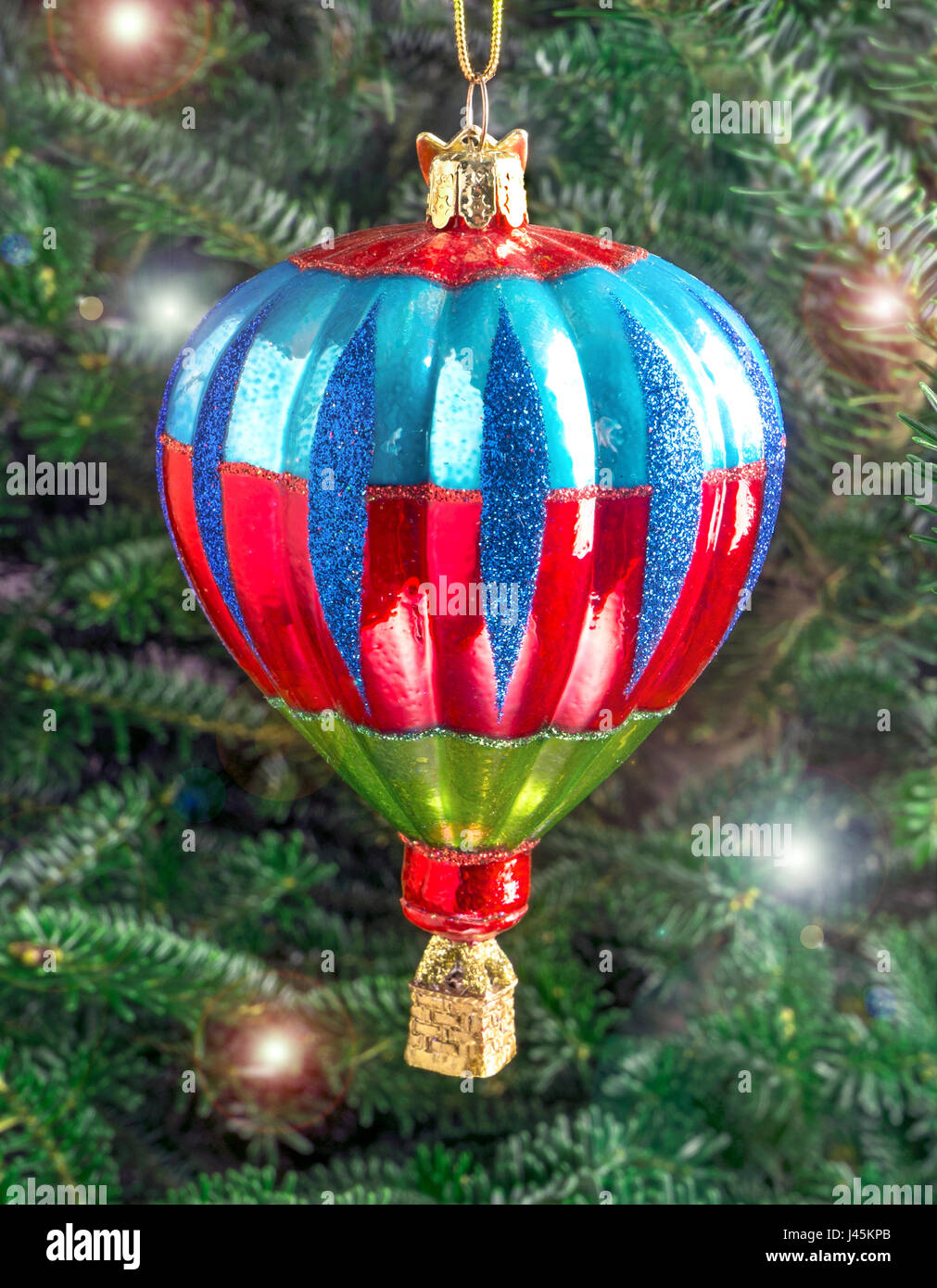 Christmas bauble hanging from a tree in the shape of a Hot Air Balloon Stock Photo