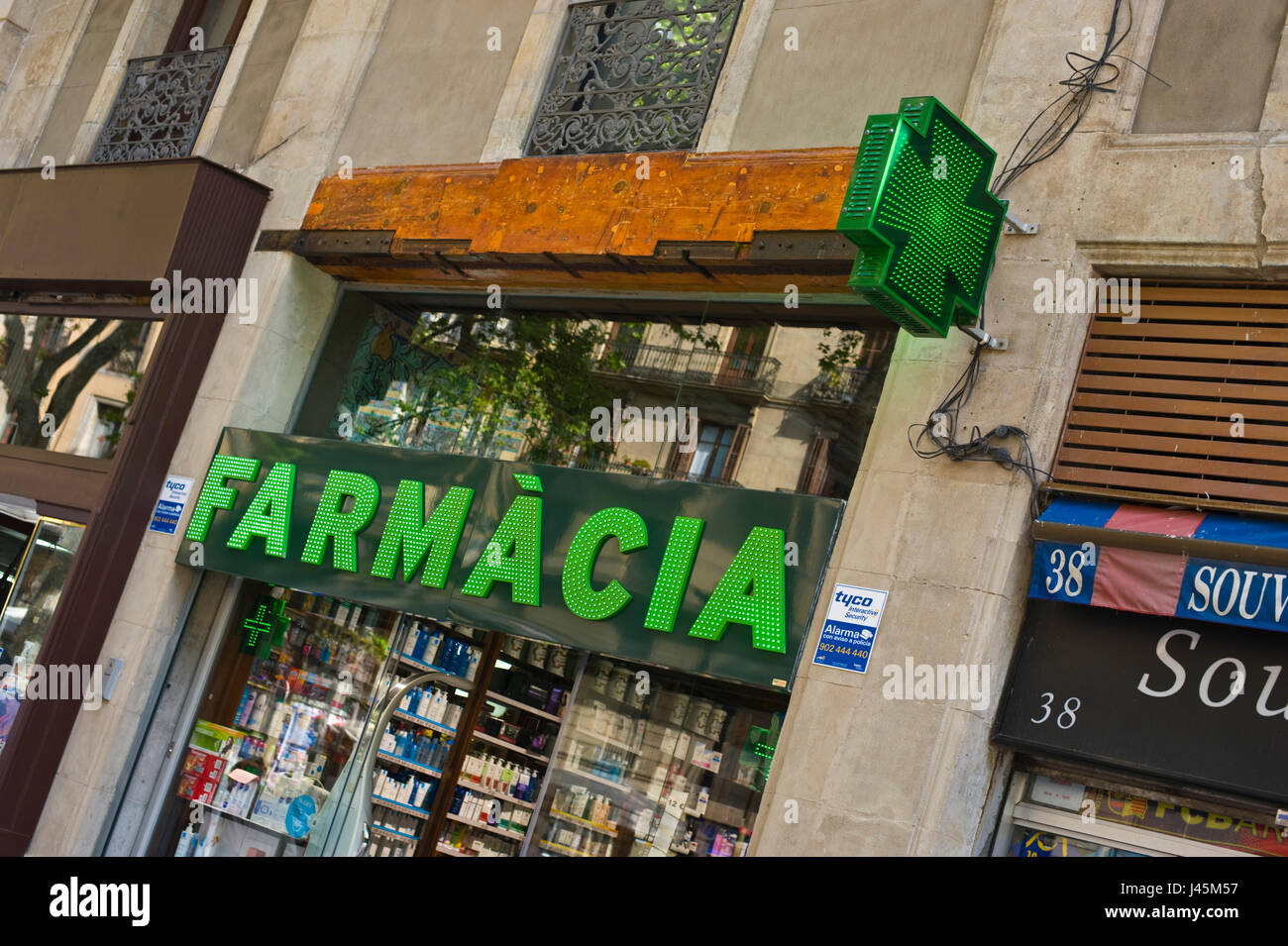 Exterior of Farmacia chemist shop on La Rambla in Barcelona Spain ES EU Stock Photo