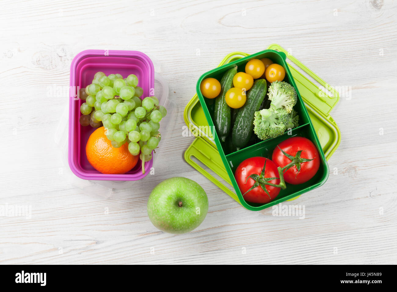 Healthy meal prep containers with fruits, berries, snacks and vegetables.  Takeaway food on white background, top view. Lunch box to school Stock  Photo - Alamy