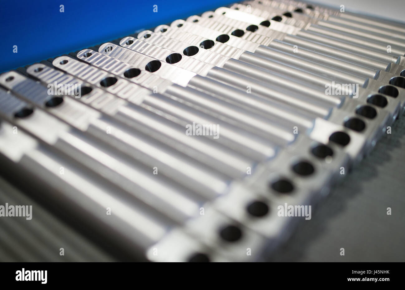 aluminum metal raw material in the form of long rods in metal factory Stock Photo